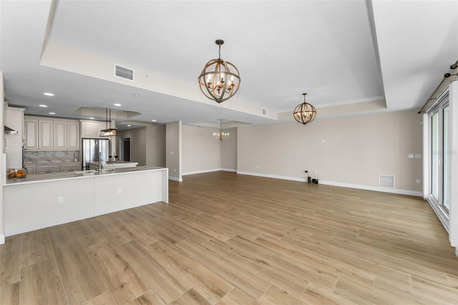 ... Looking In.. Great Room makes use of over 1100 Square Feet and includes Living Room - Dining Area - Breakfast Bar / Kitchen Area - Formal Dining Area - TV or Media Area - Additional Lounging Area .
