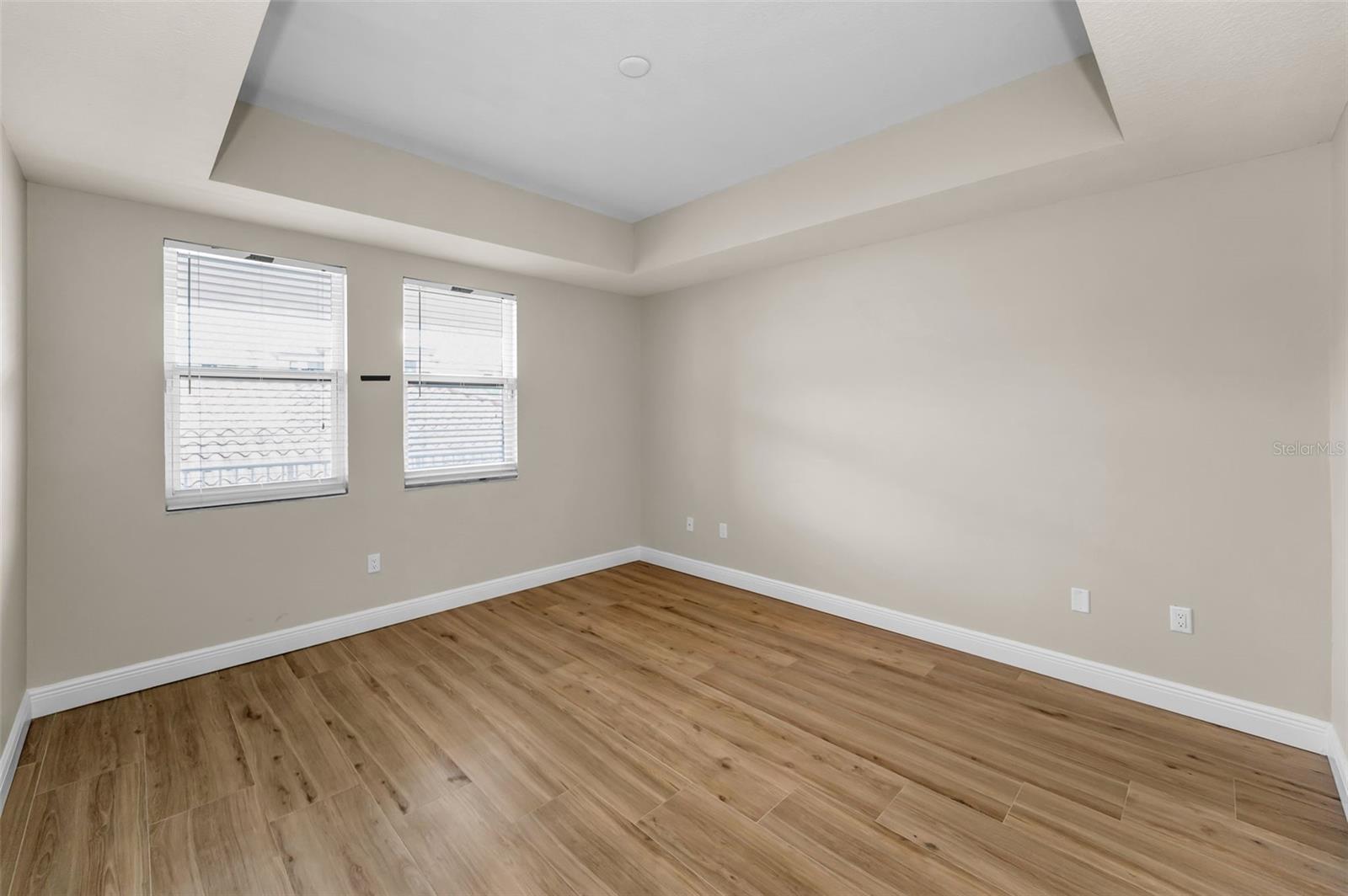 .. Bedroom Number 3 or Primary Guest Suite ( 12 X 14 ) - Complete With Private Full Bath & WIC. All NEW WALL TRIM  & WOODVILLE NATURAL WOOD PORCELAIN TILE FLOORING.