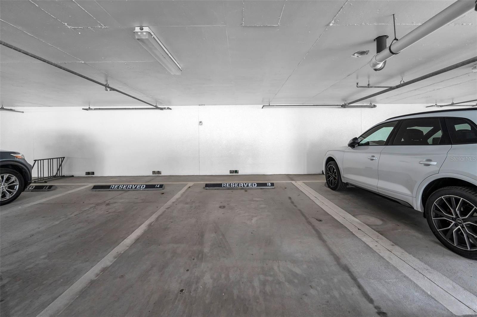 .... Inside Spot #15... Residence # 202 Conveys with Two Parking Spots.. Number 15 Under the Building and #37 Outside Near The Lobby. Additionally, There is a Generous Amount of Guest Parking.
