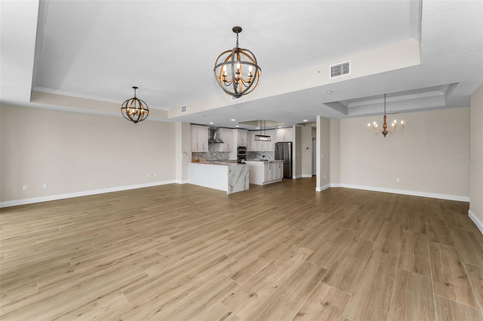 ..New Flooring - Woodville Natural Wood Plank Porcelain Tile in 1100 Sq FT Great Room. Residence # 202 is all Set For Your Personal Touches..  Interior Designer Opted For a Neutral  Palette so New Owners Could Apply Personal Touches to Complete the Interior Ambience.