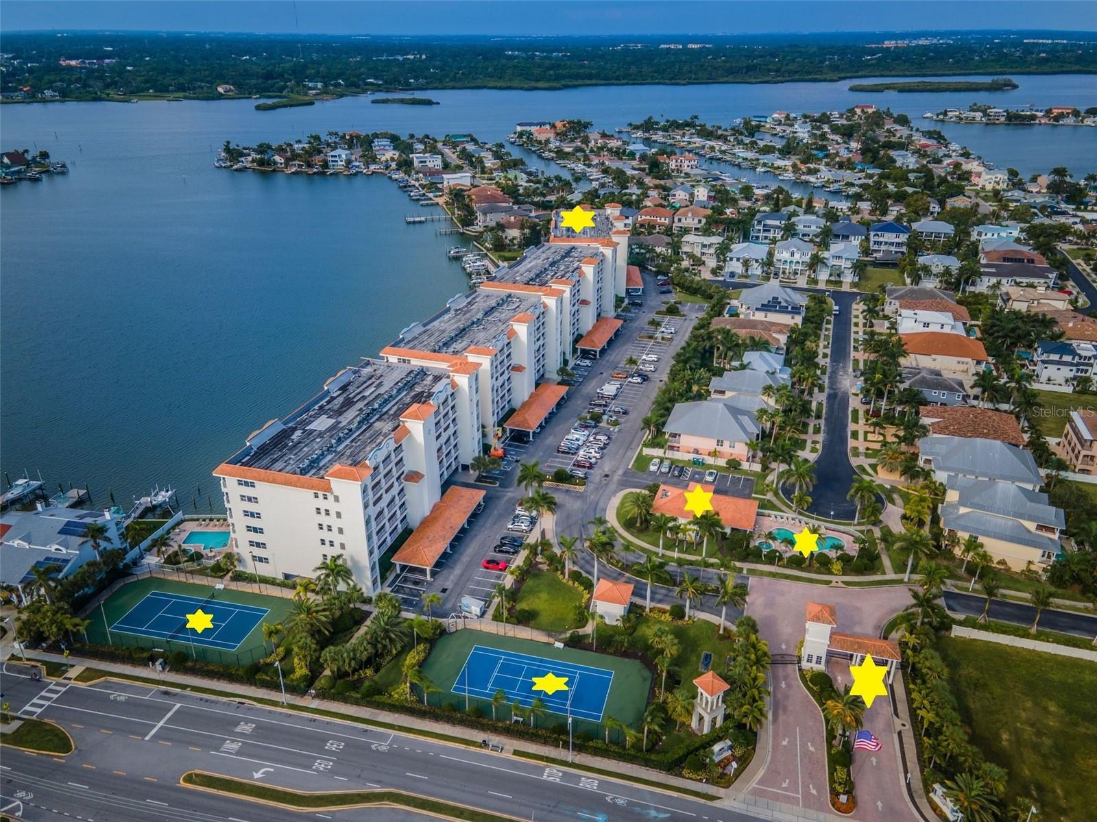 .. Tennis Courts x2  - Guard Gate - Common Heated Pool - Clubhouse / Fitness Center - La Bahia Building.