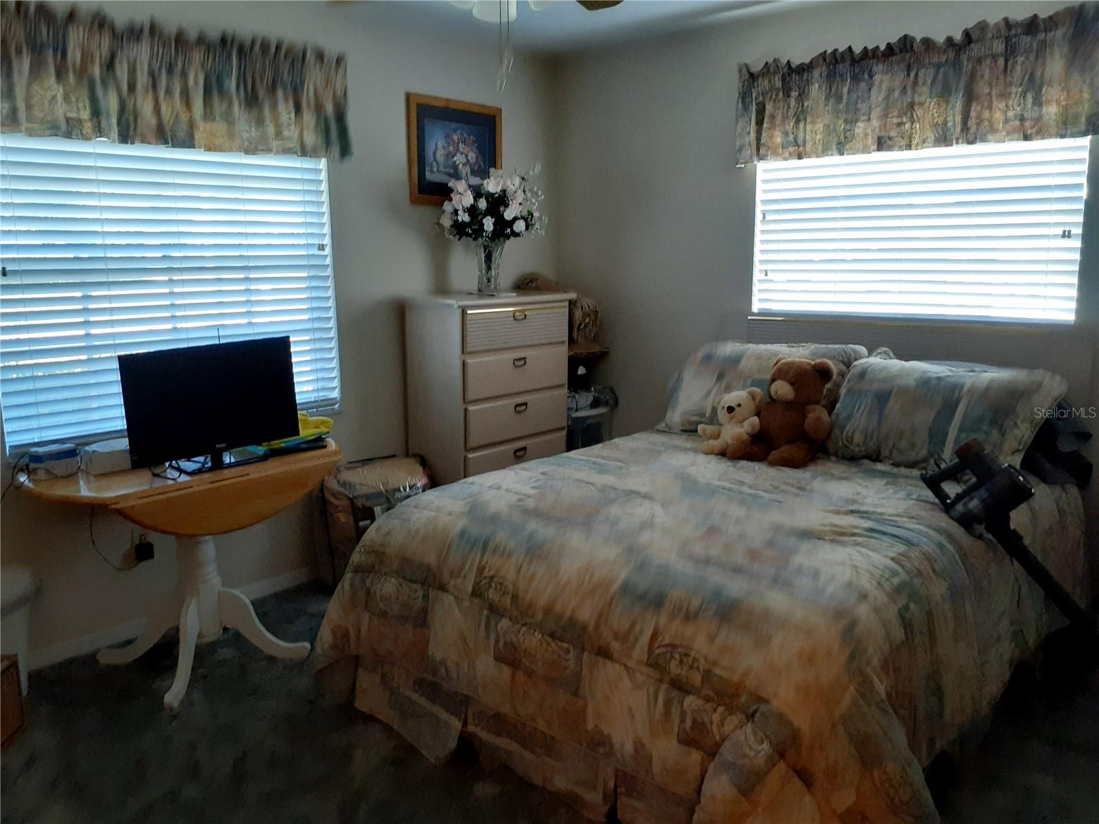 Bedroom 2 with ceiling fan and lights