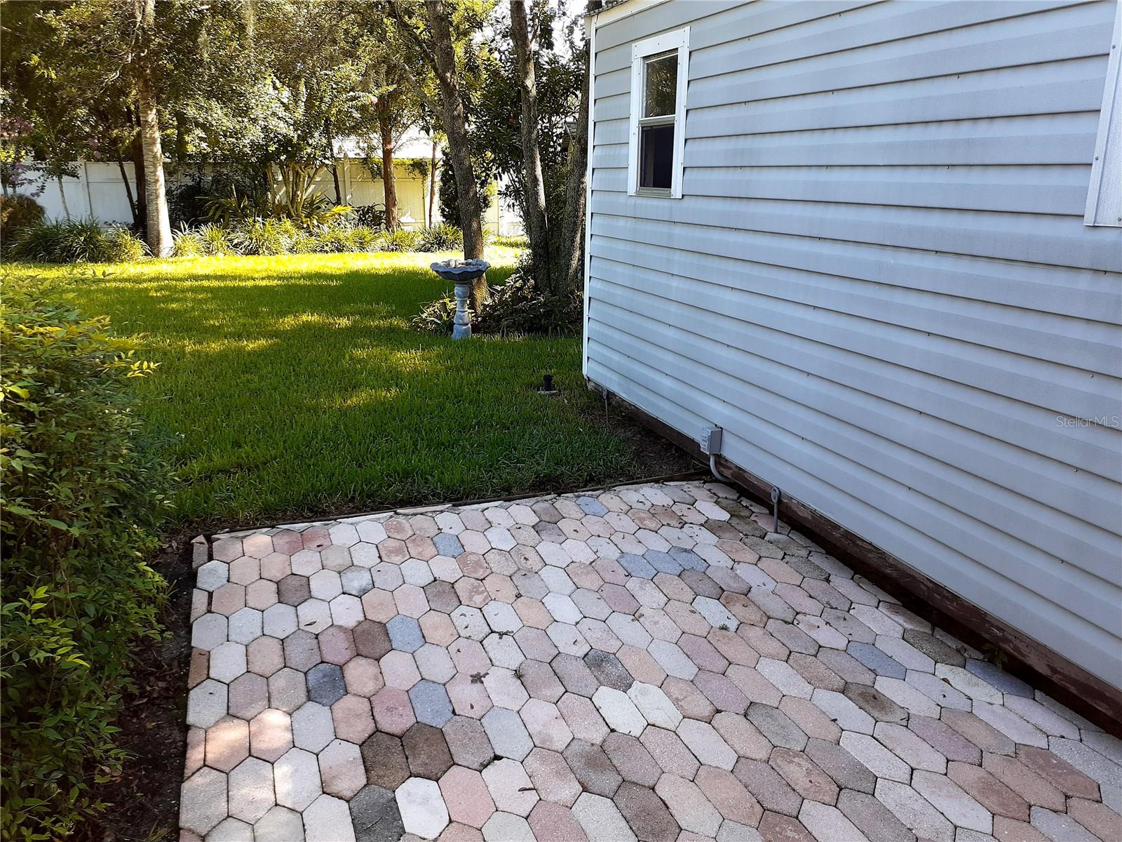 Extra pavers beside this unit and another storage to the back