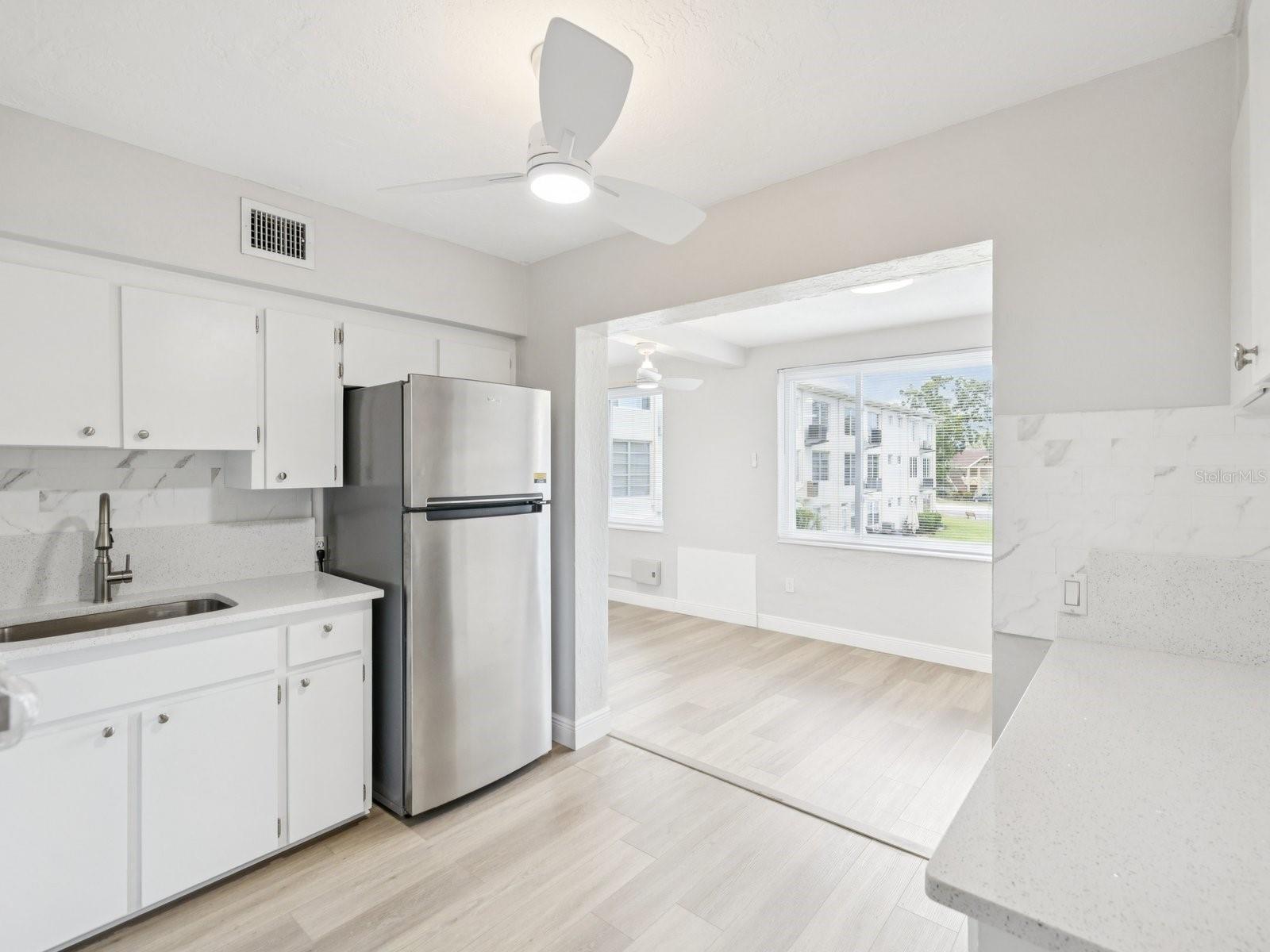 Kitchen view to beautiful Florida room