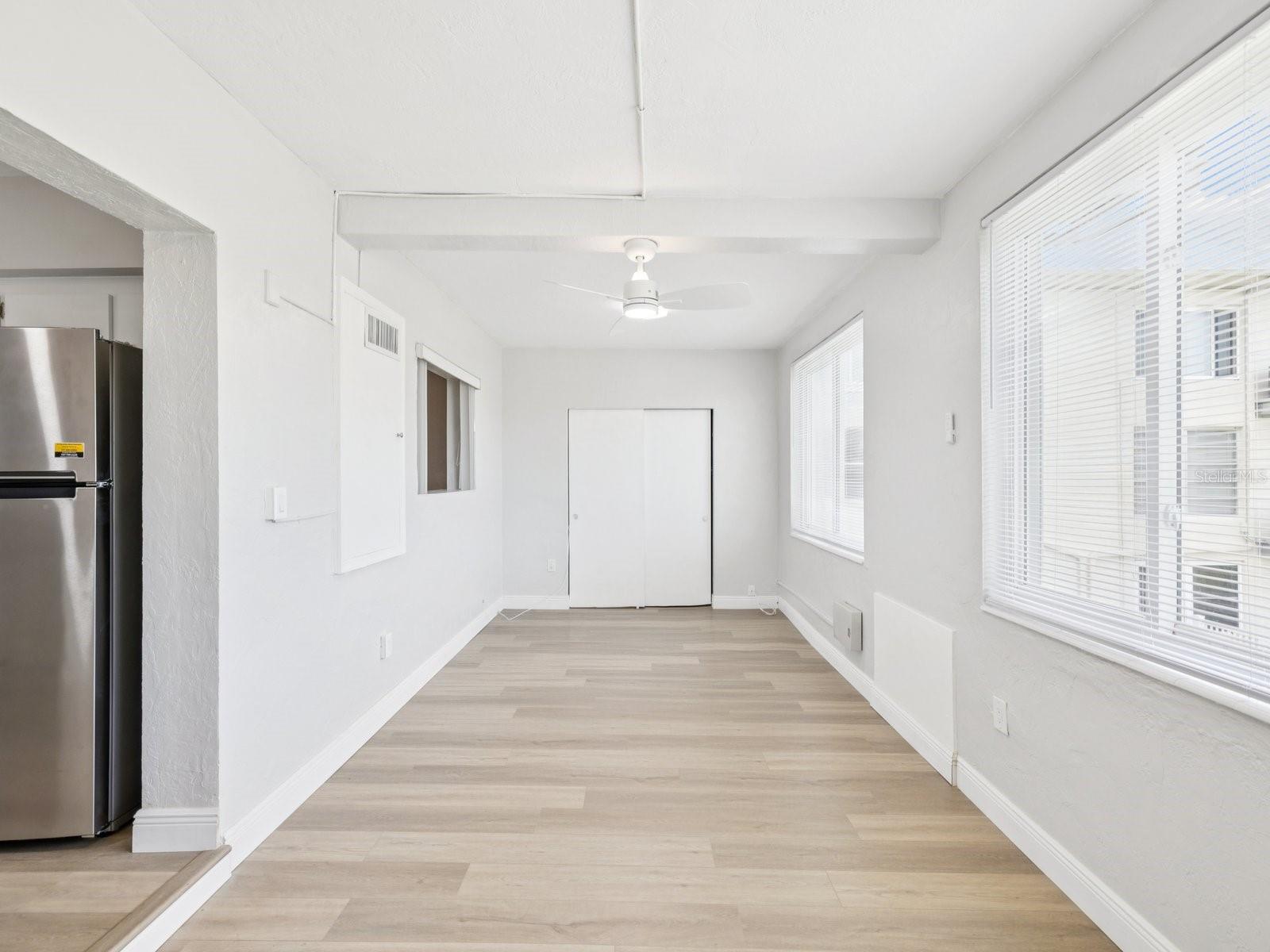 Florida room with wall of windows and storage closet