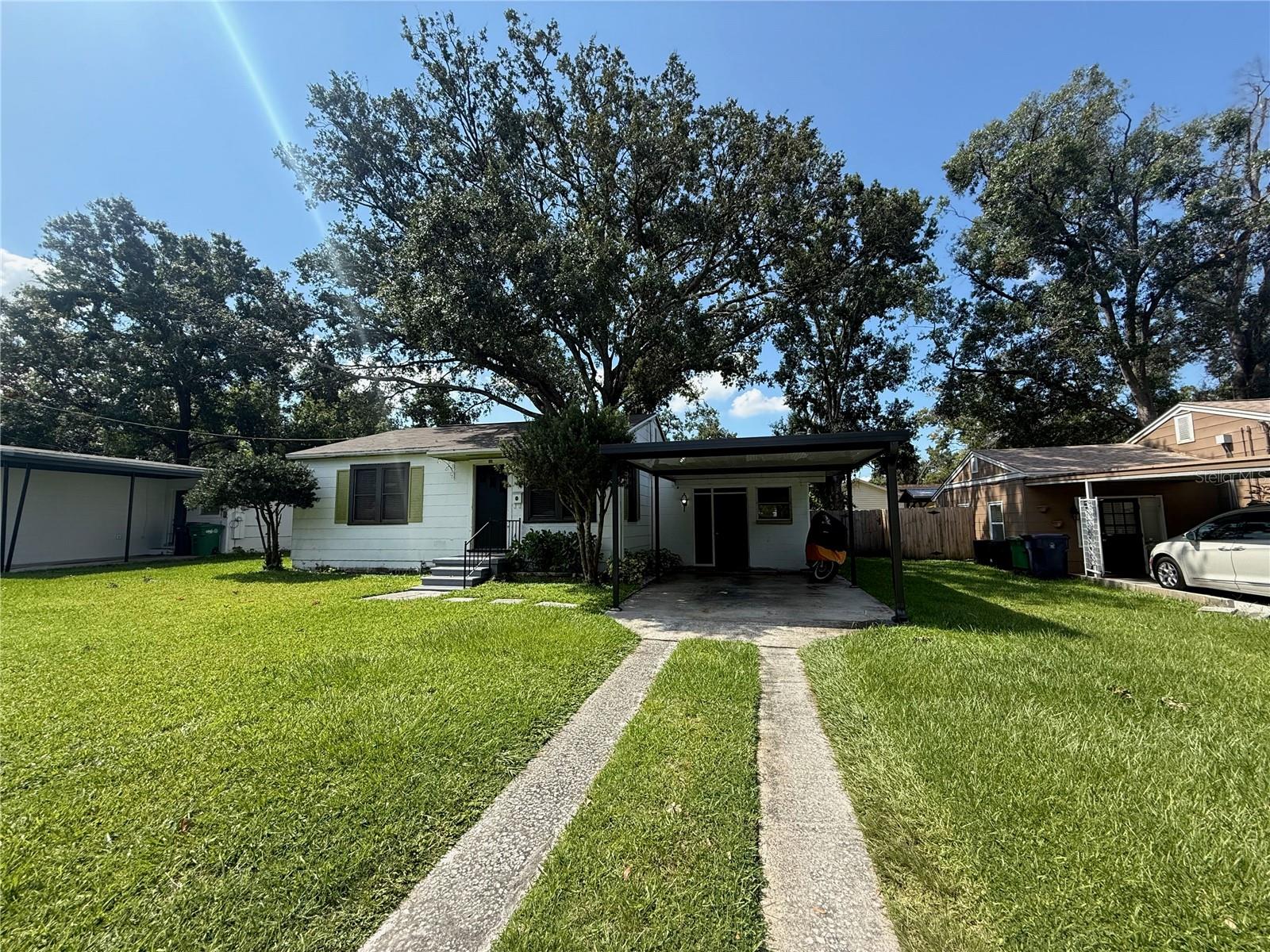 Front of house with huge yard
