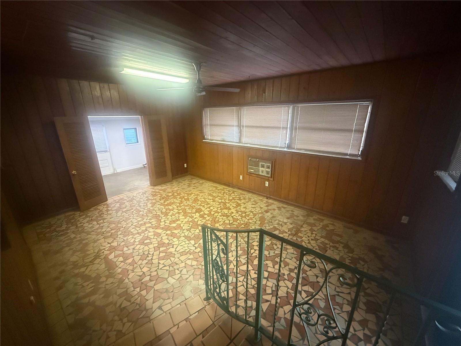 Large family room or additional space that leads to backyard and large laundry room