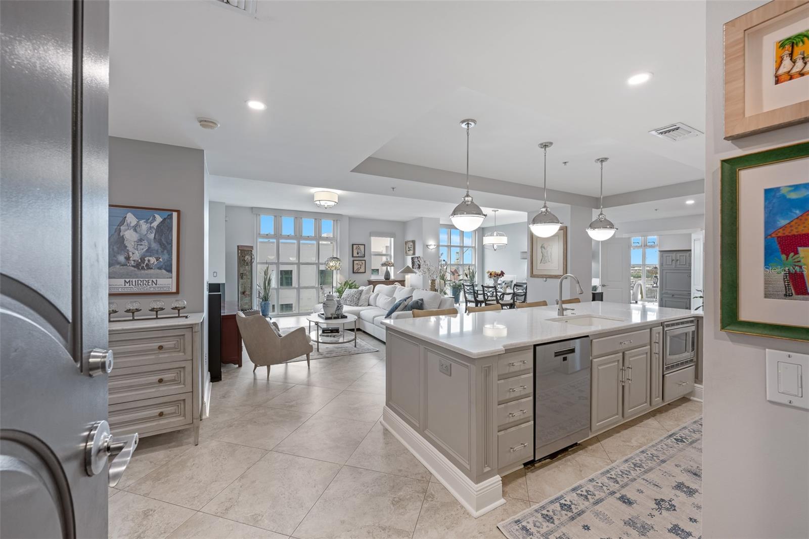 Welcome to your expansive nearly 65 ft wide corner unit with floor to ceiling windows