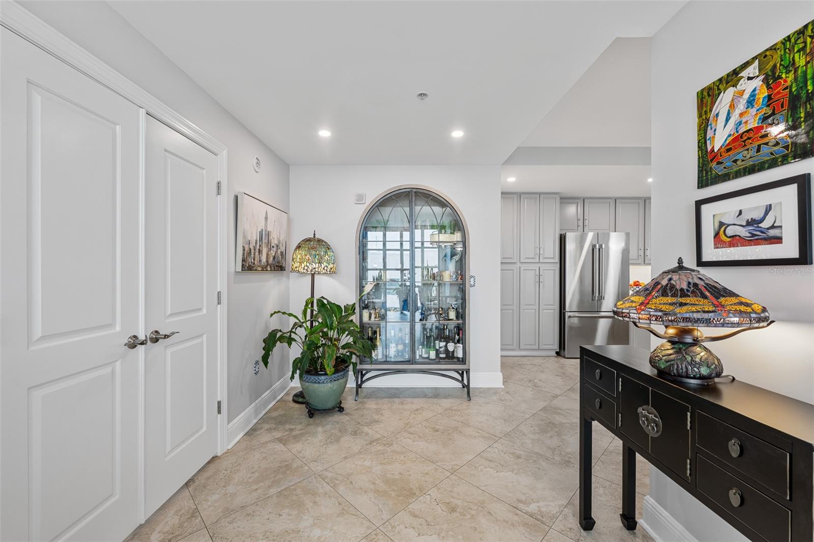 Enter your primary suite through these double-french doors