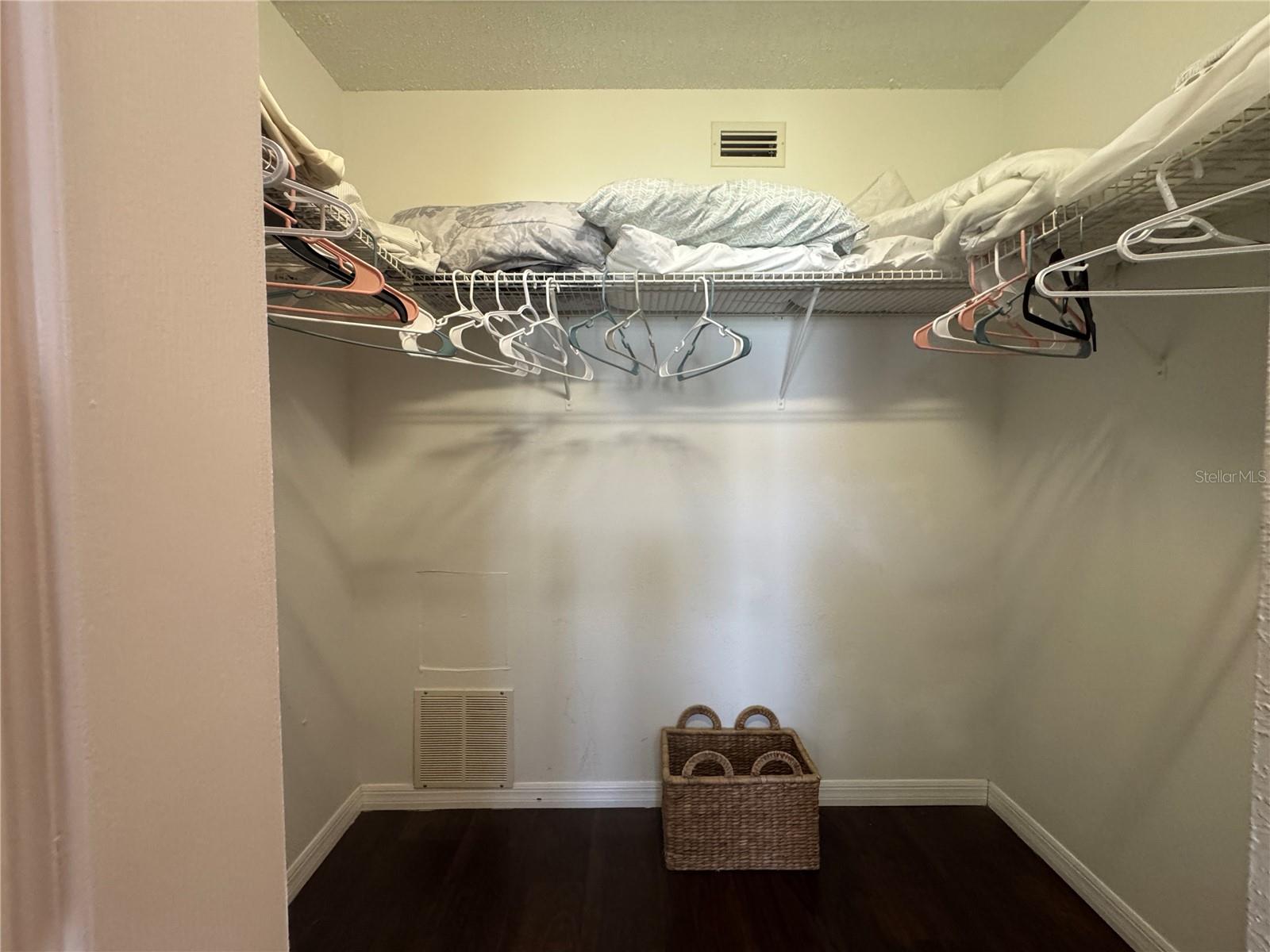 Primary bedroom walk-in closet.