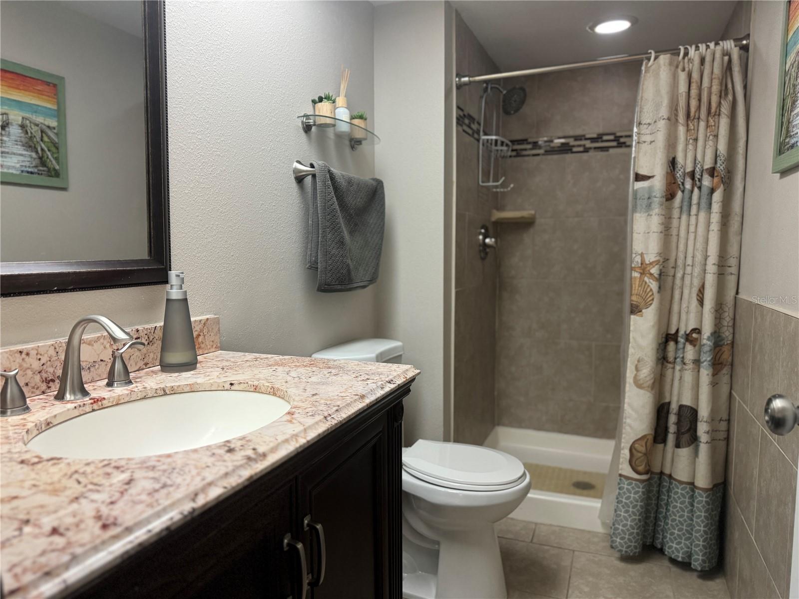 Primary bedroom ensuite bathroom with walk-in shower.