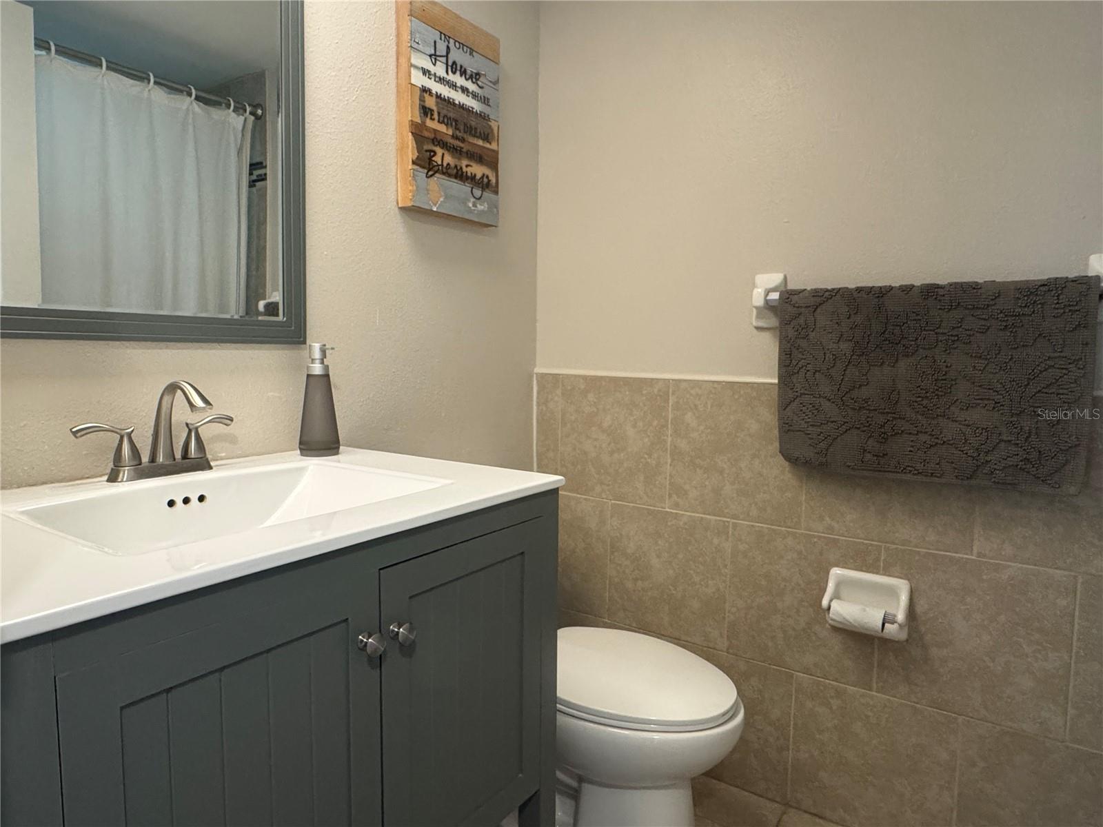 Guest bathroom with tub/shower combo.