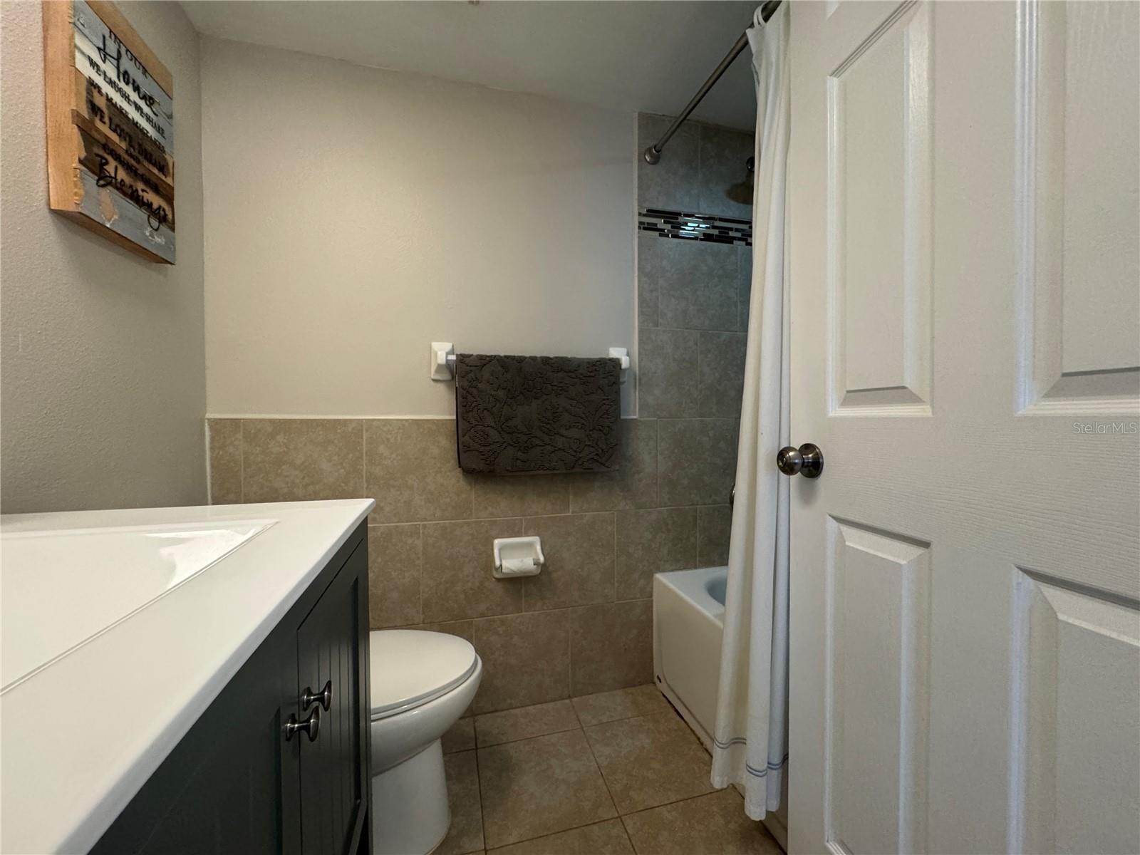 Guest bathroom with tub/shower combo.