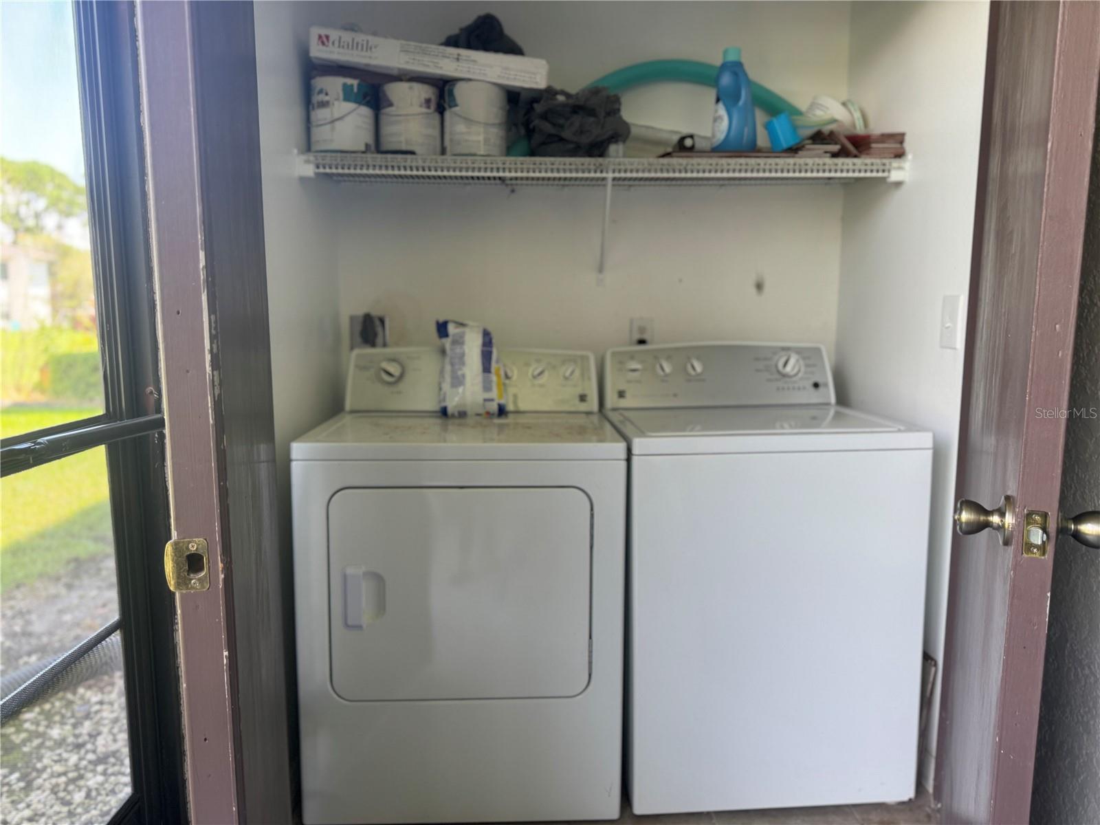 Laundry closet on screened back porch.
