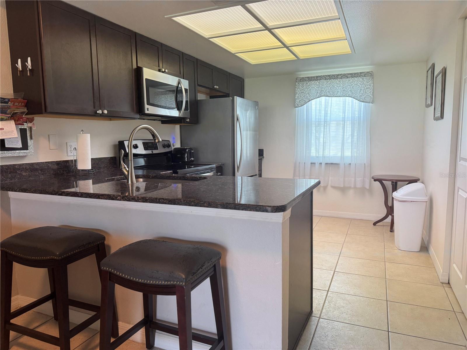 Kitchen with granite countertops and loads of storage!
