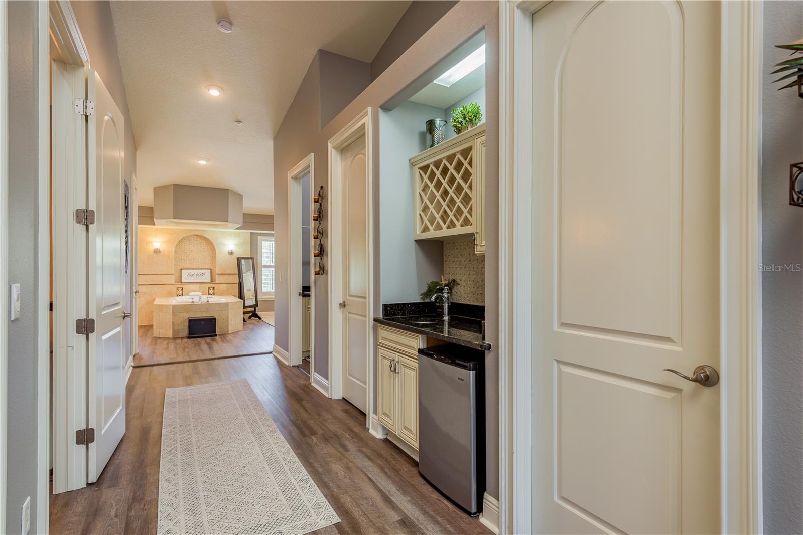 Master corridor to Laundry, Beverage Bar, and Spa Bathroom