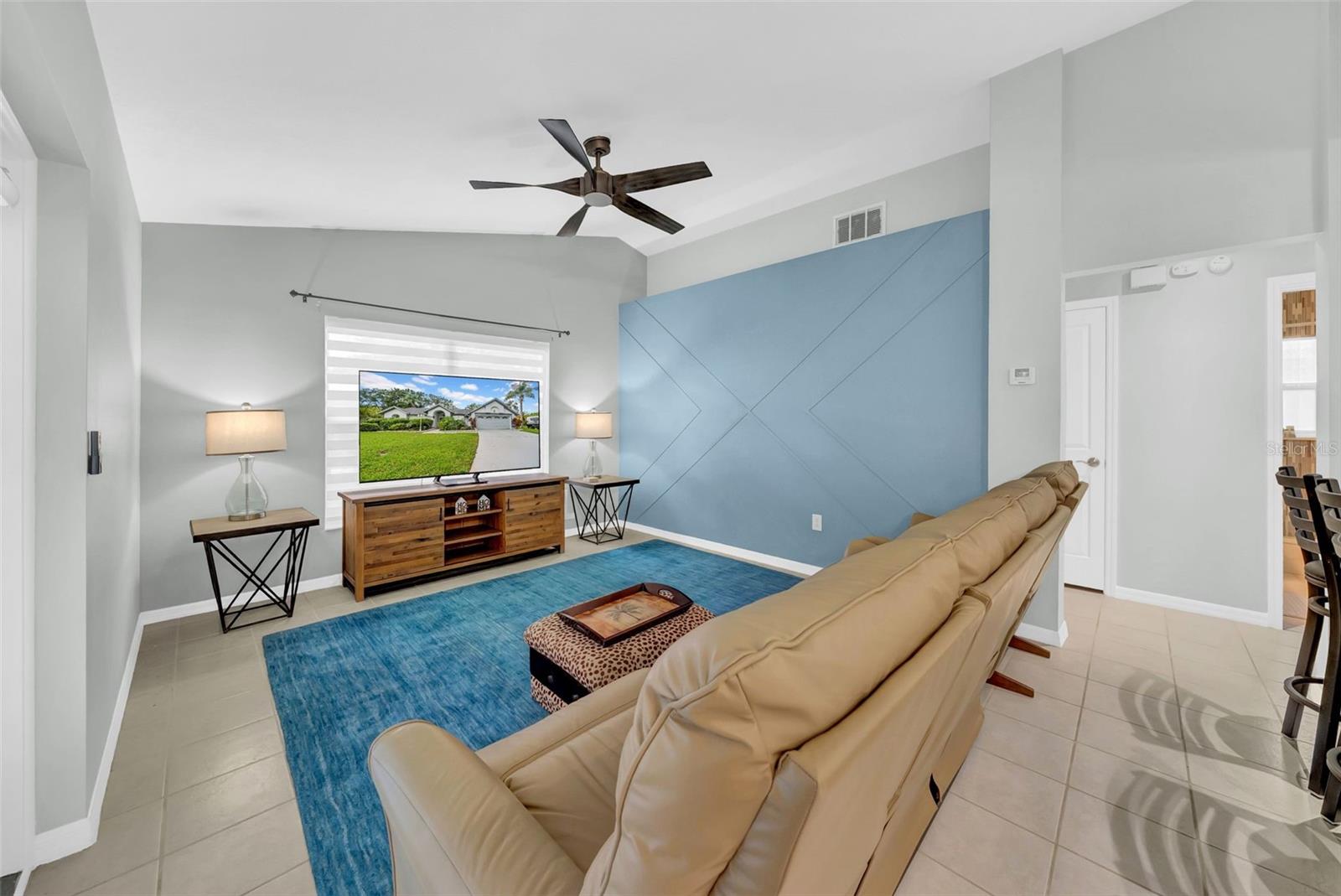 Family room with french doors leading to the pool area.