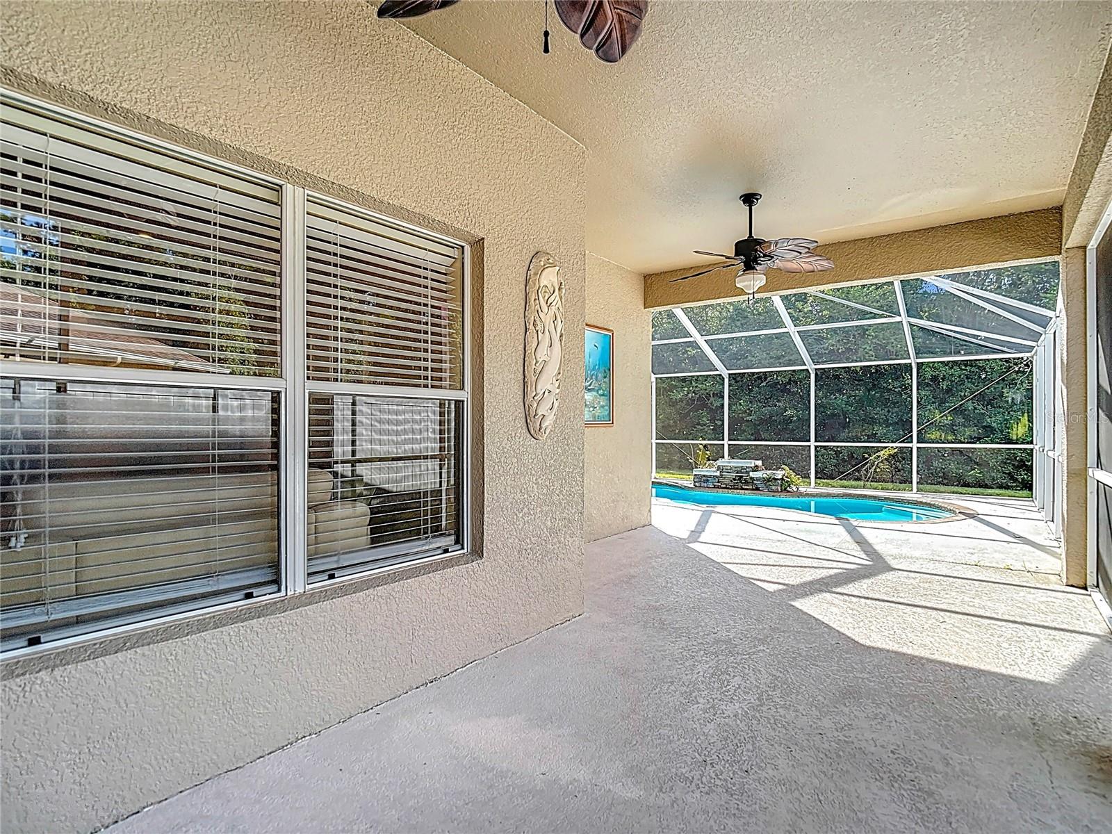 Large screened-in lanai and pool area