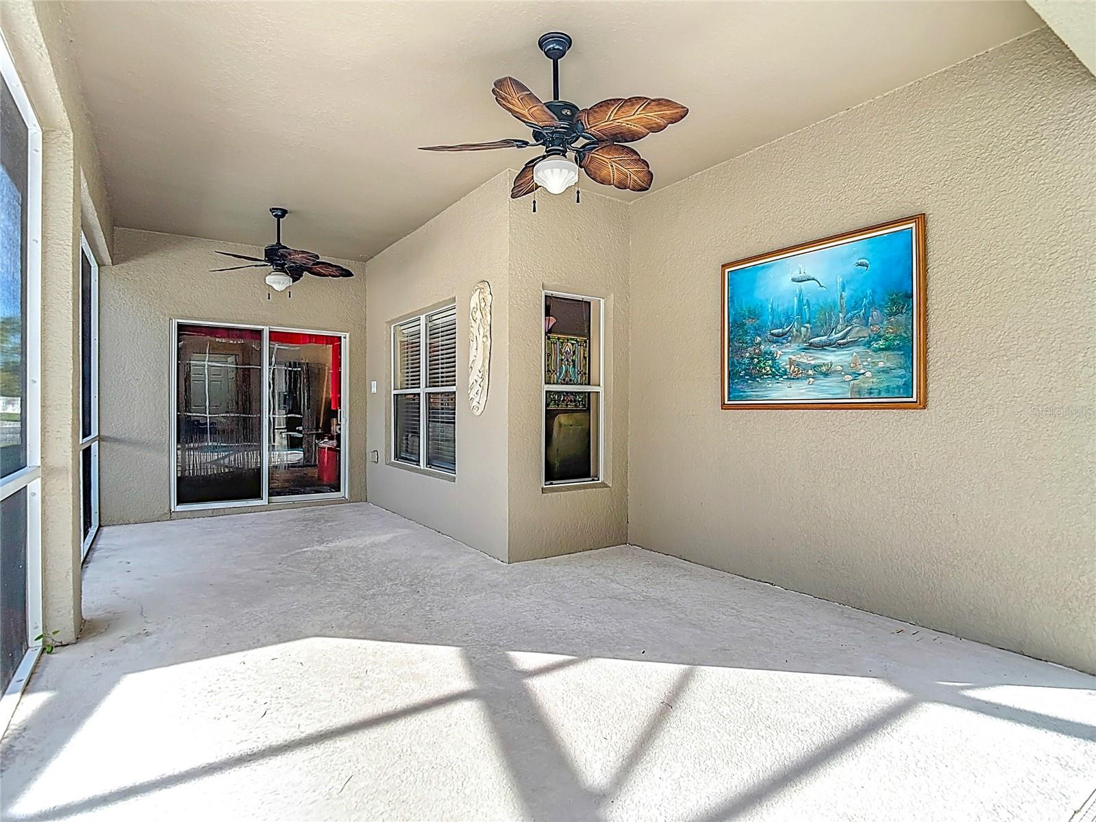 Large screened-in lanai and pool area