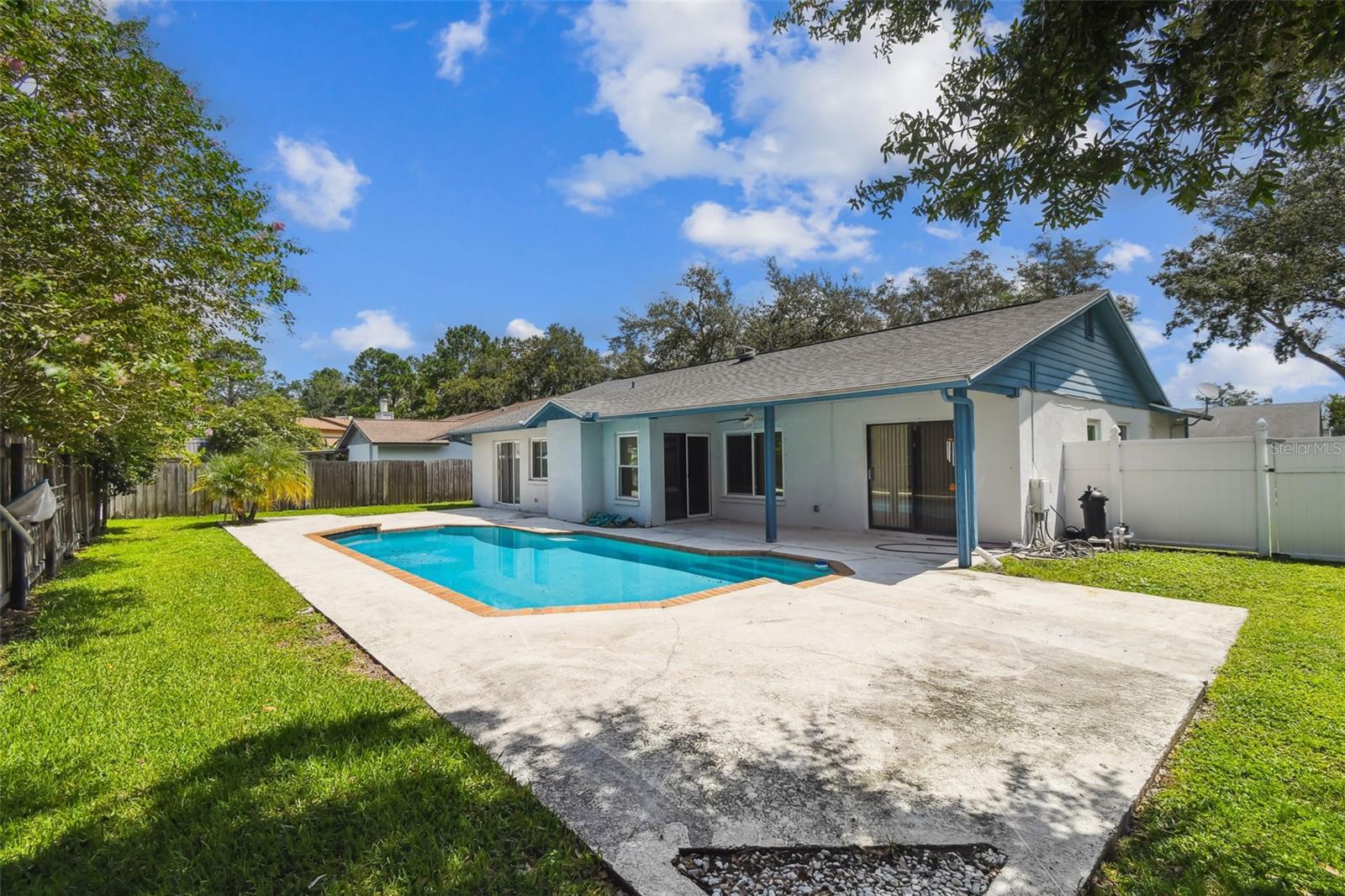 Huge pool in the fully fenced backyard w/covered patio