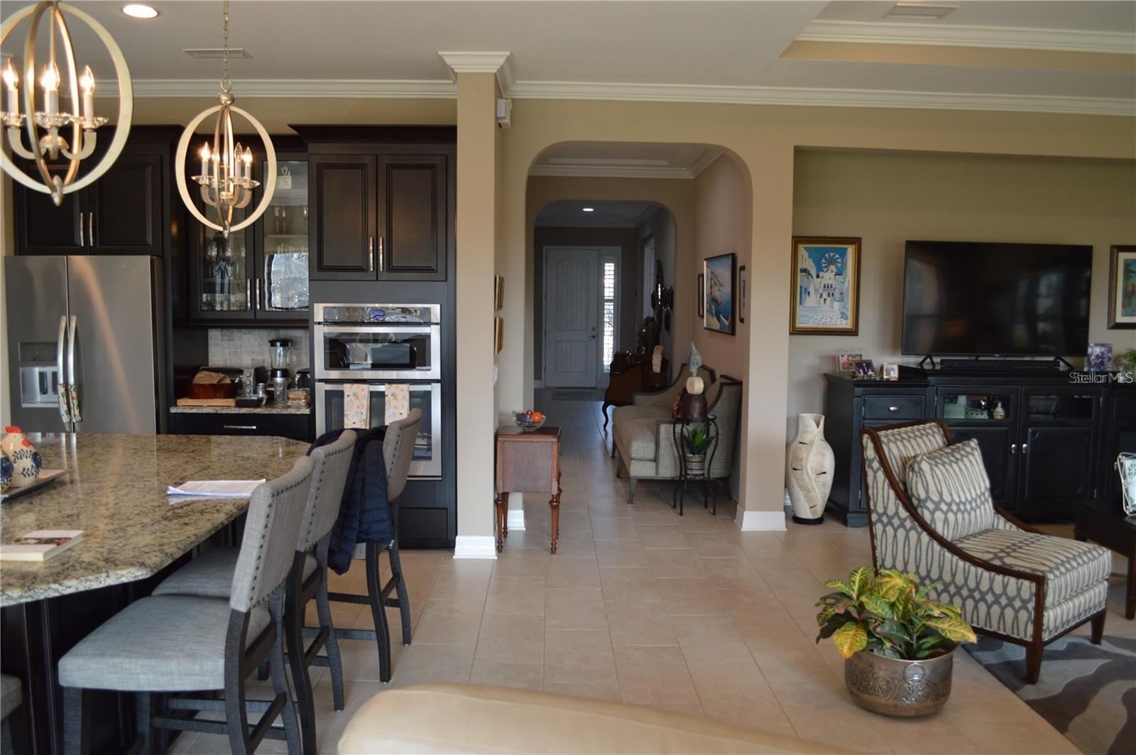 Kitchen, hallway and living room open area.