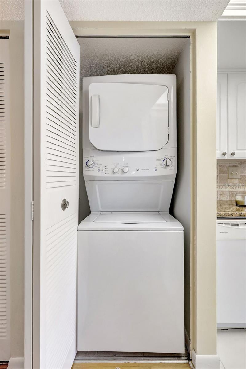 Full size washer and dryer off the kitchen