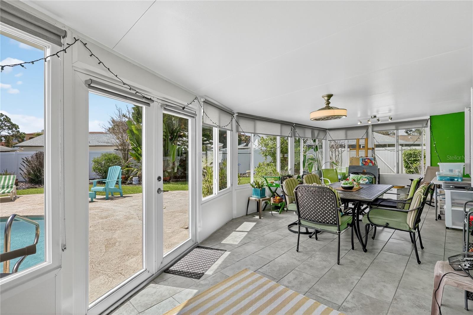 Enclosed porch overlooks the pool
