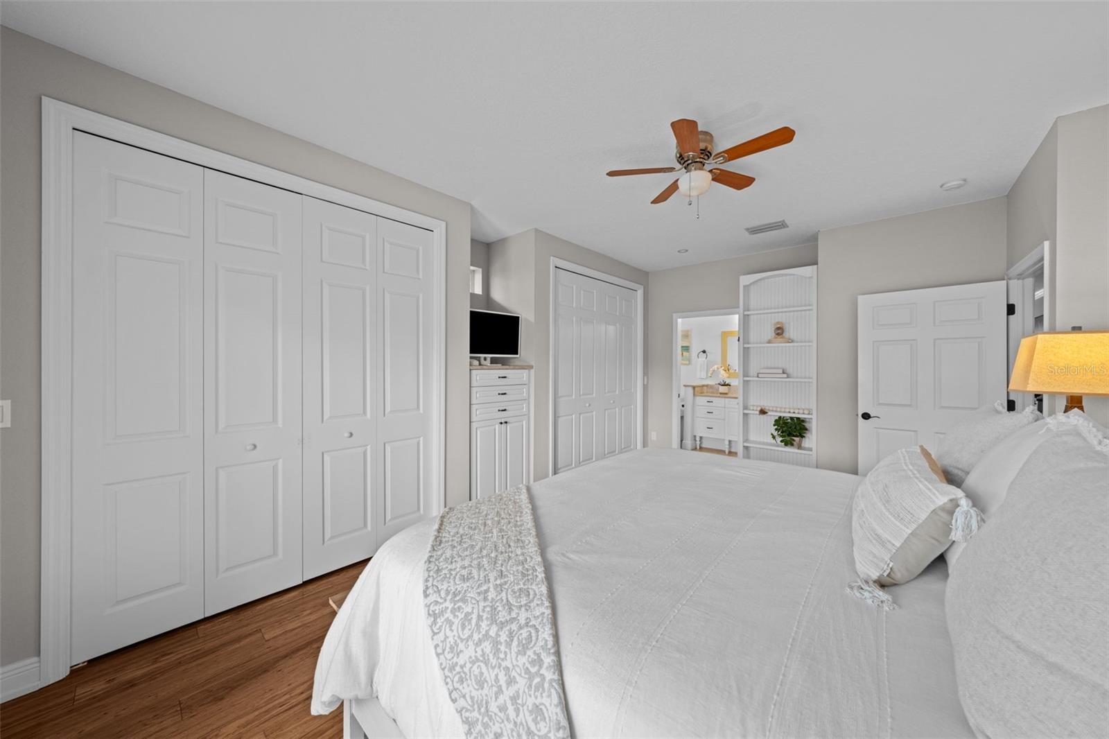 Primary Bedroom with two Closets and Custom Built ins.