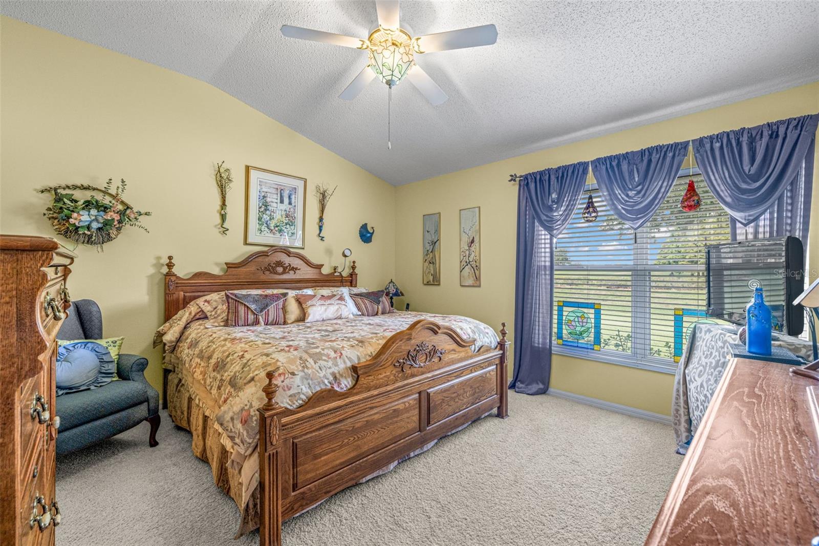 Large primary bedroom with vaulted ceilings