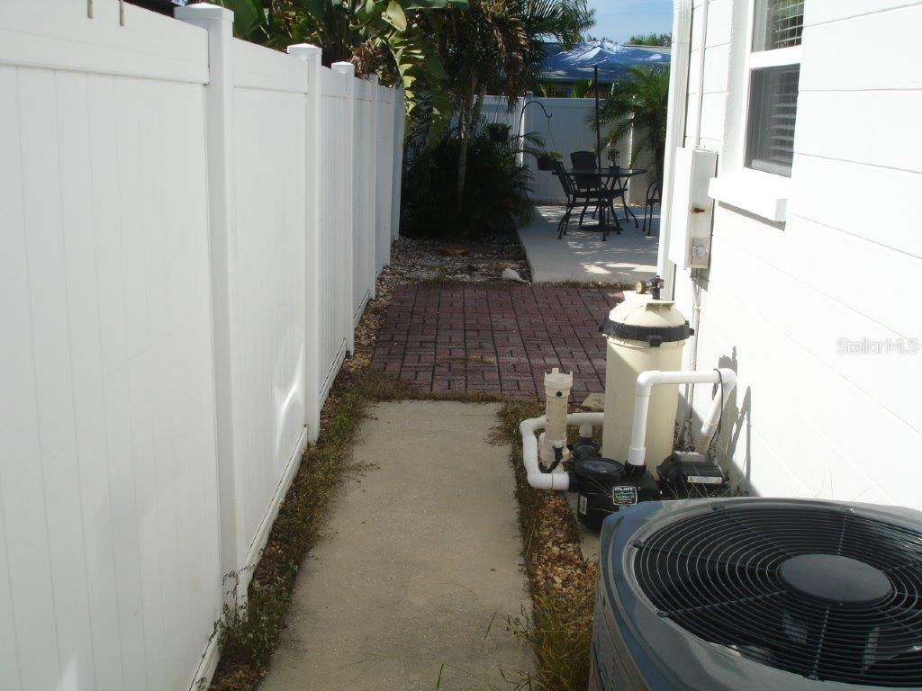 sidewalk from front to back yard west side