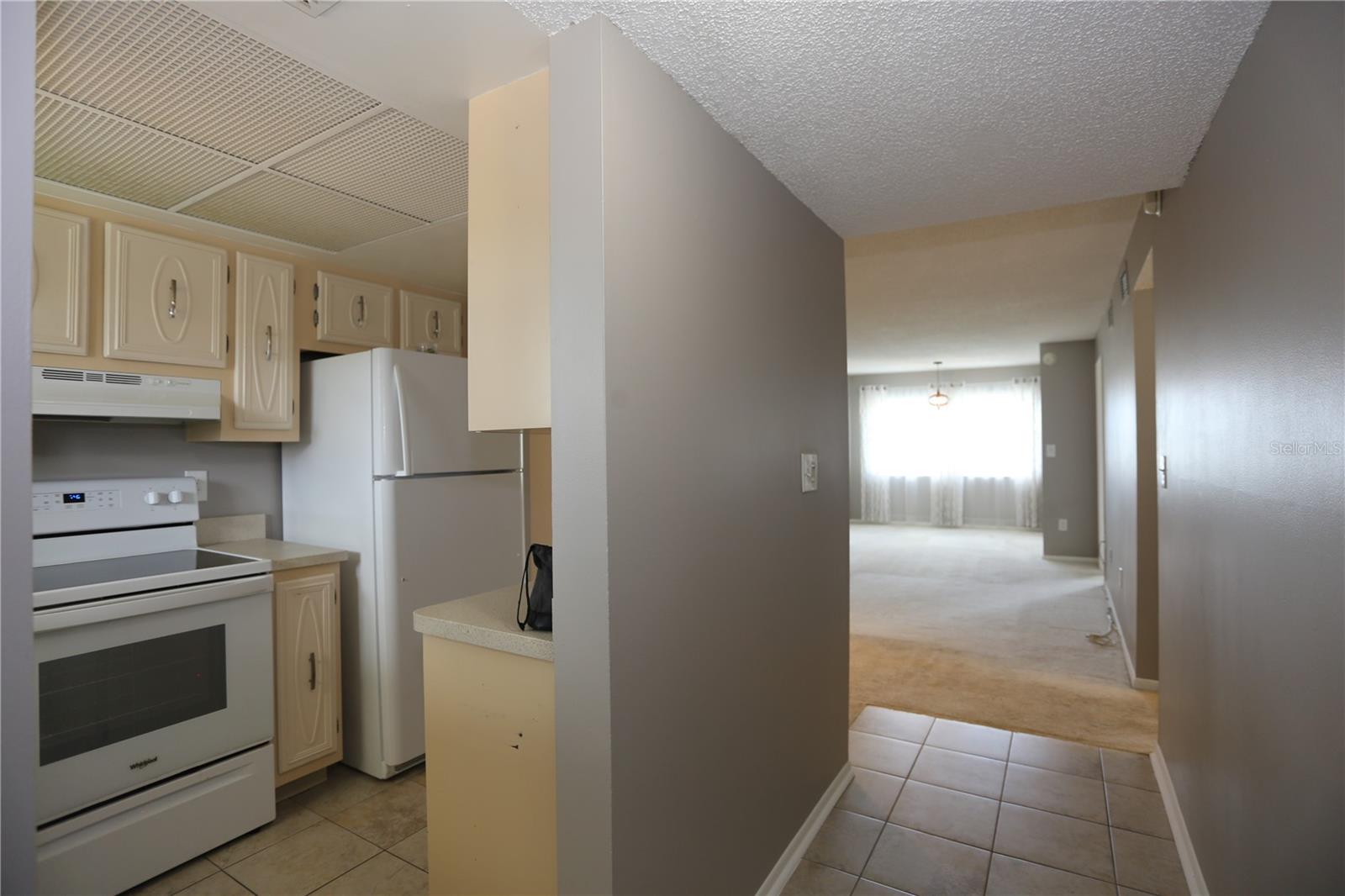Enter past the kitchen to the great room large enough for dining, living and bonus space
