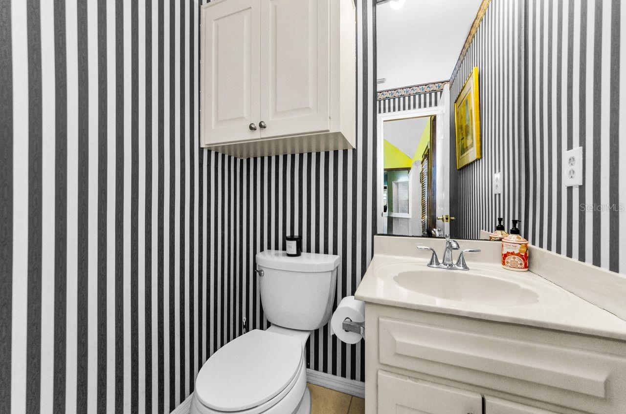 Half bath located near family room and kitchen.