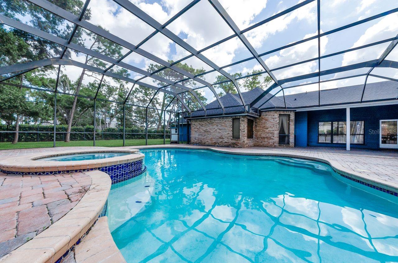 Large pool and spa with brick pavers and so much room for entertaining family and friends! No home behind you! New Roof, July 2025
