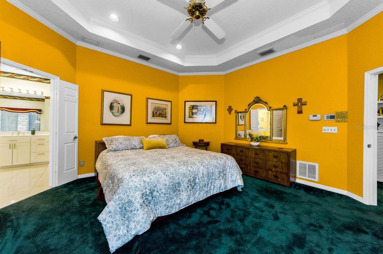 Master bedroom opens to the spacious en suite bath with walk in shower and tub and huge walk in closet