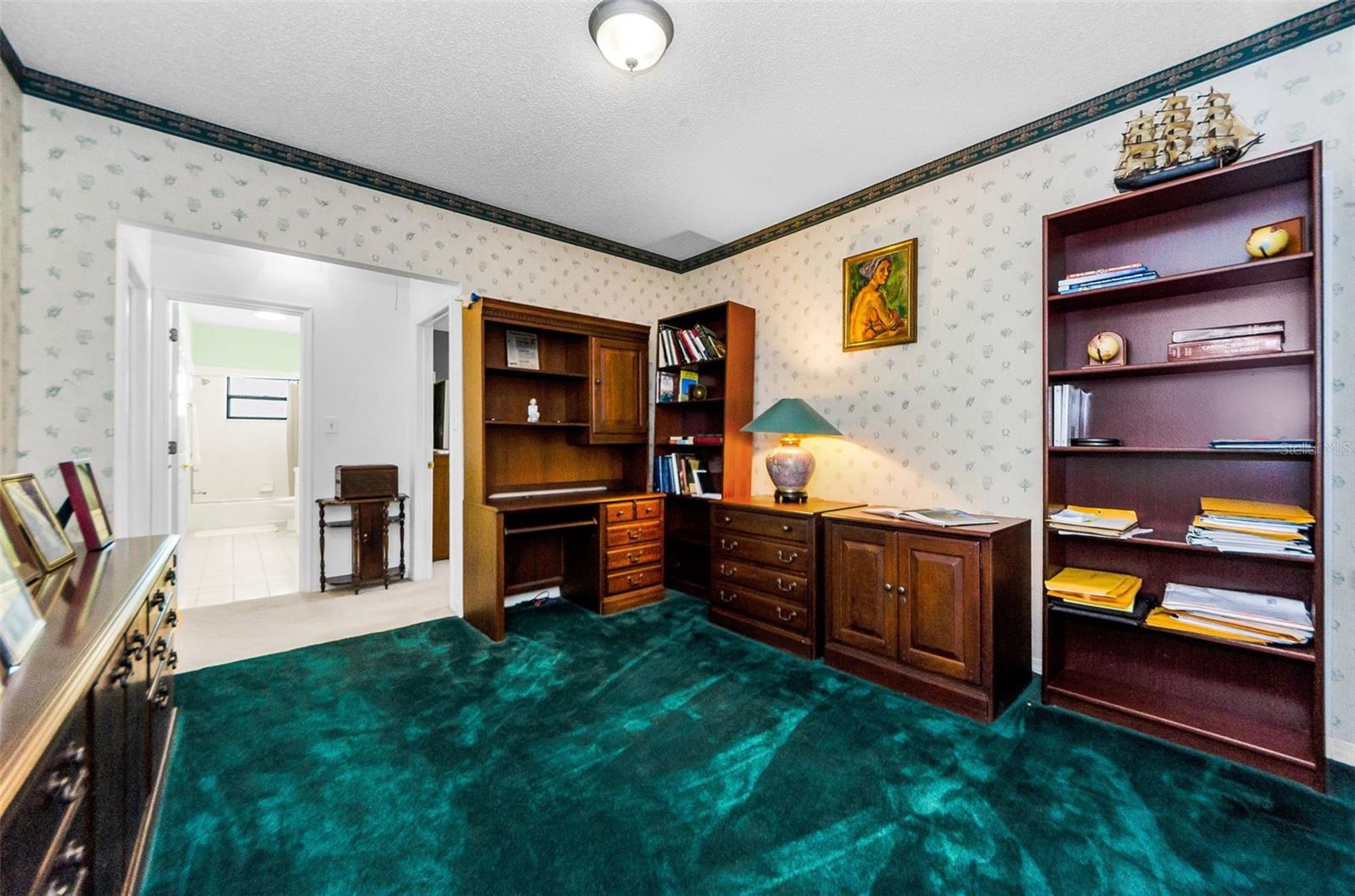 Study or Den, looking to bedrooms 2 and 3 and the back hallway full bath.