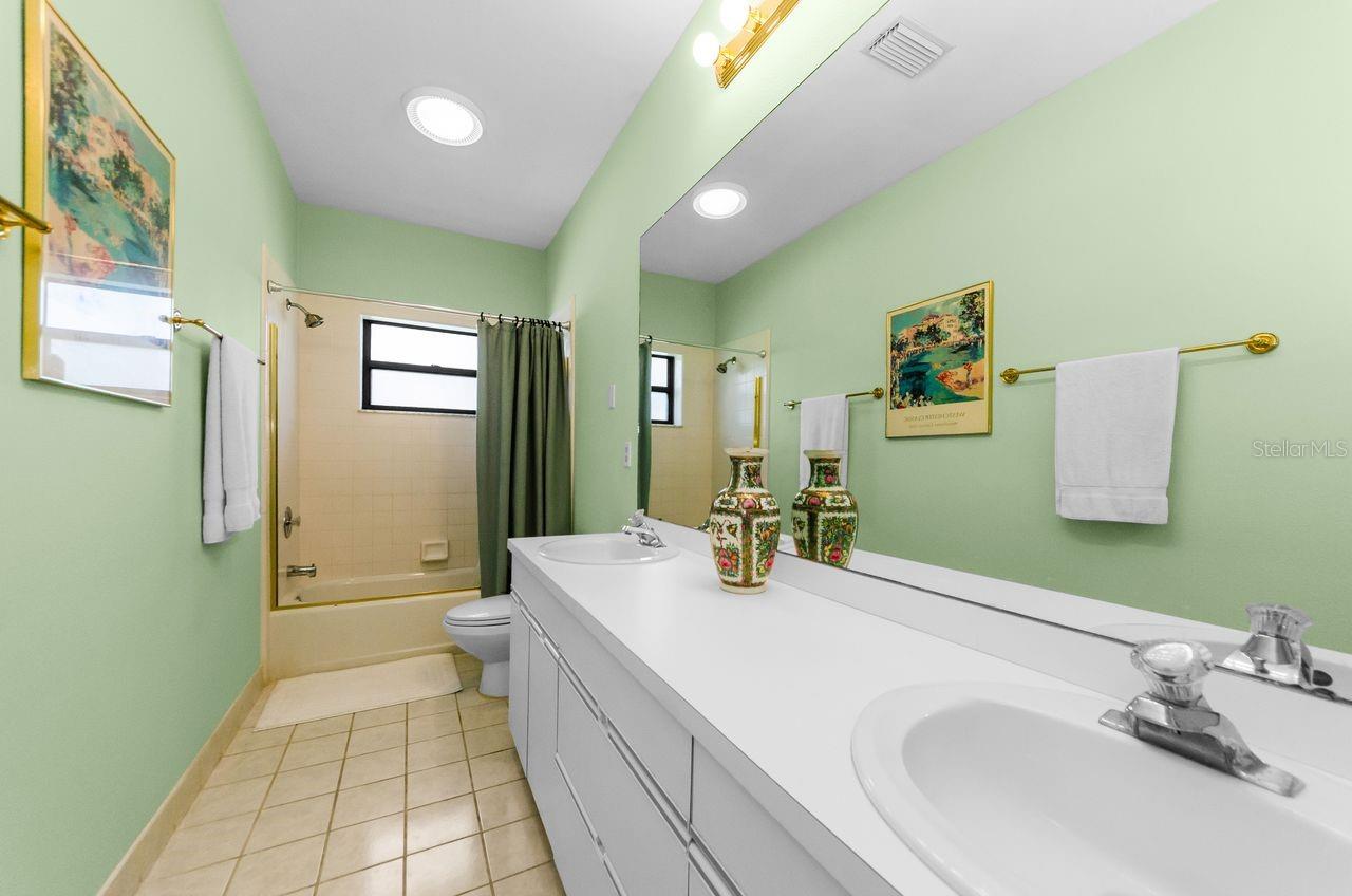 Hall bath between bedrooms 2 and 3 with tub shower and double vanity! So much space!