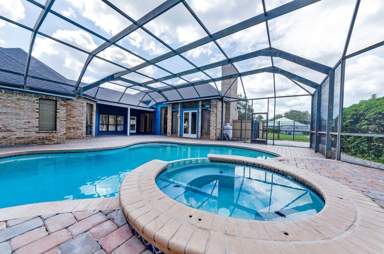 View of pool spa which is viewed from the living room, entry and dining room and family room! So Open!