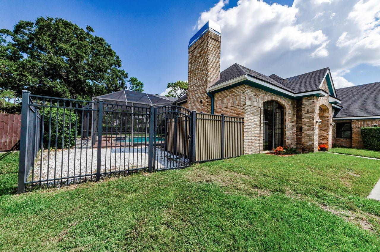 Beautiful fencing surrounding the back yard and pool area!