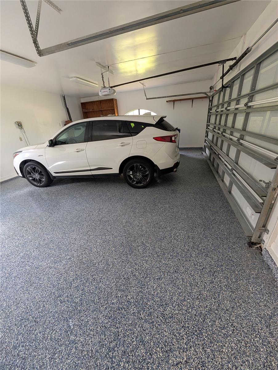 Spacious garage with new epoxy floor finish!