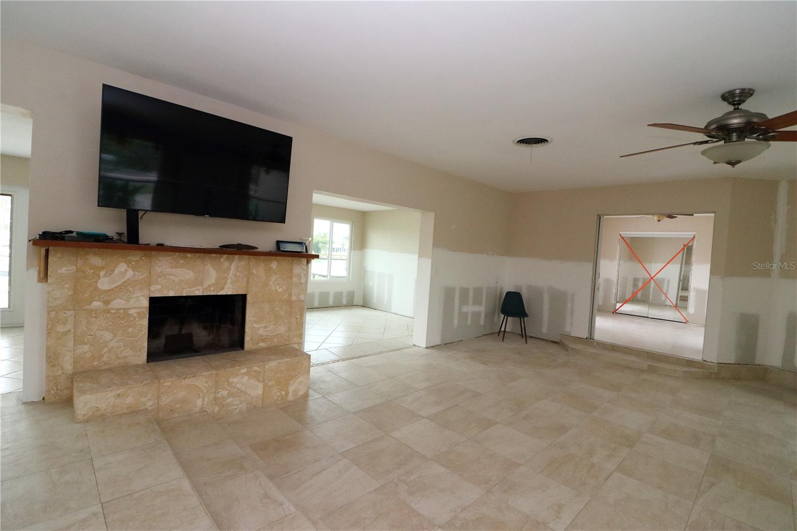 Wood Burning, Raised Hearth Fireplace with Manbtel in Living Room
