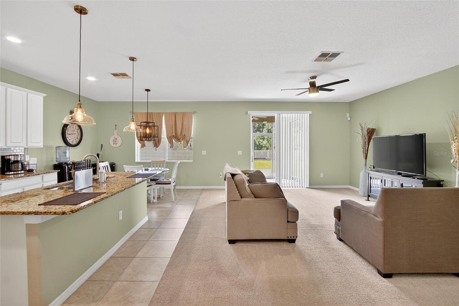 Foyer facing kitchen and living