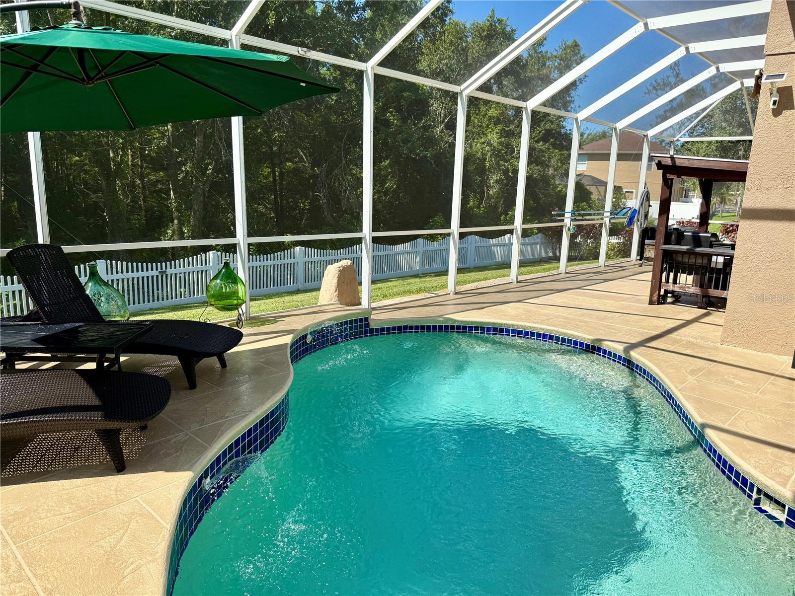 Large lanai area for grilling, games, and storage