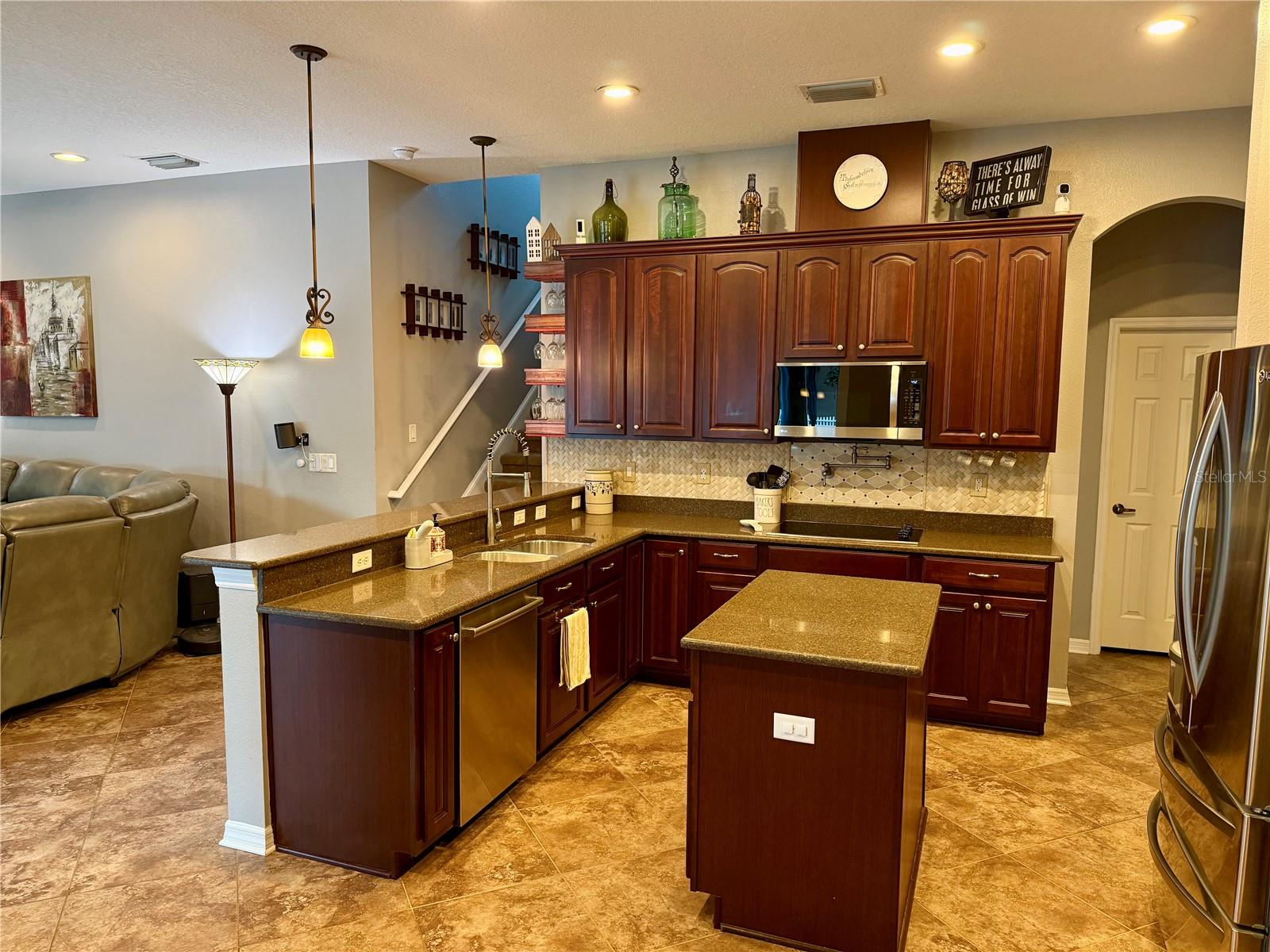 Kitchen - notice backsplash and pot-filler faucet
