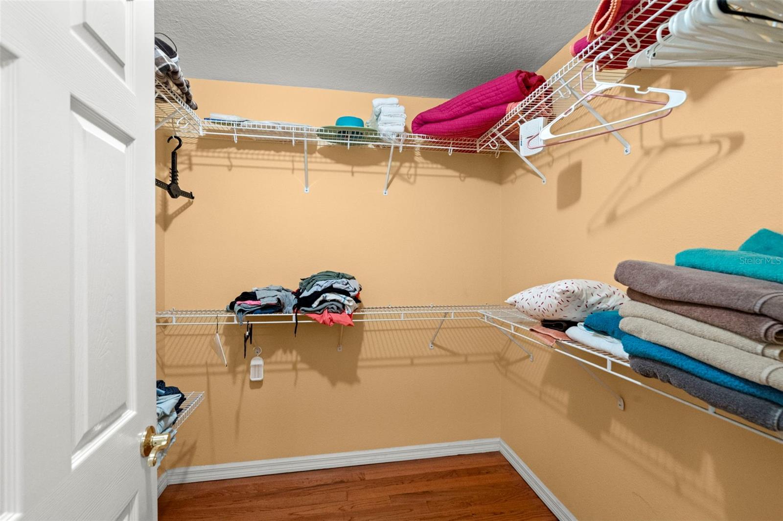 Walk in closet in primary bedroom