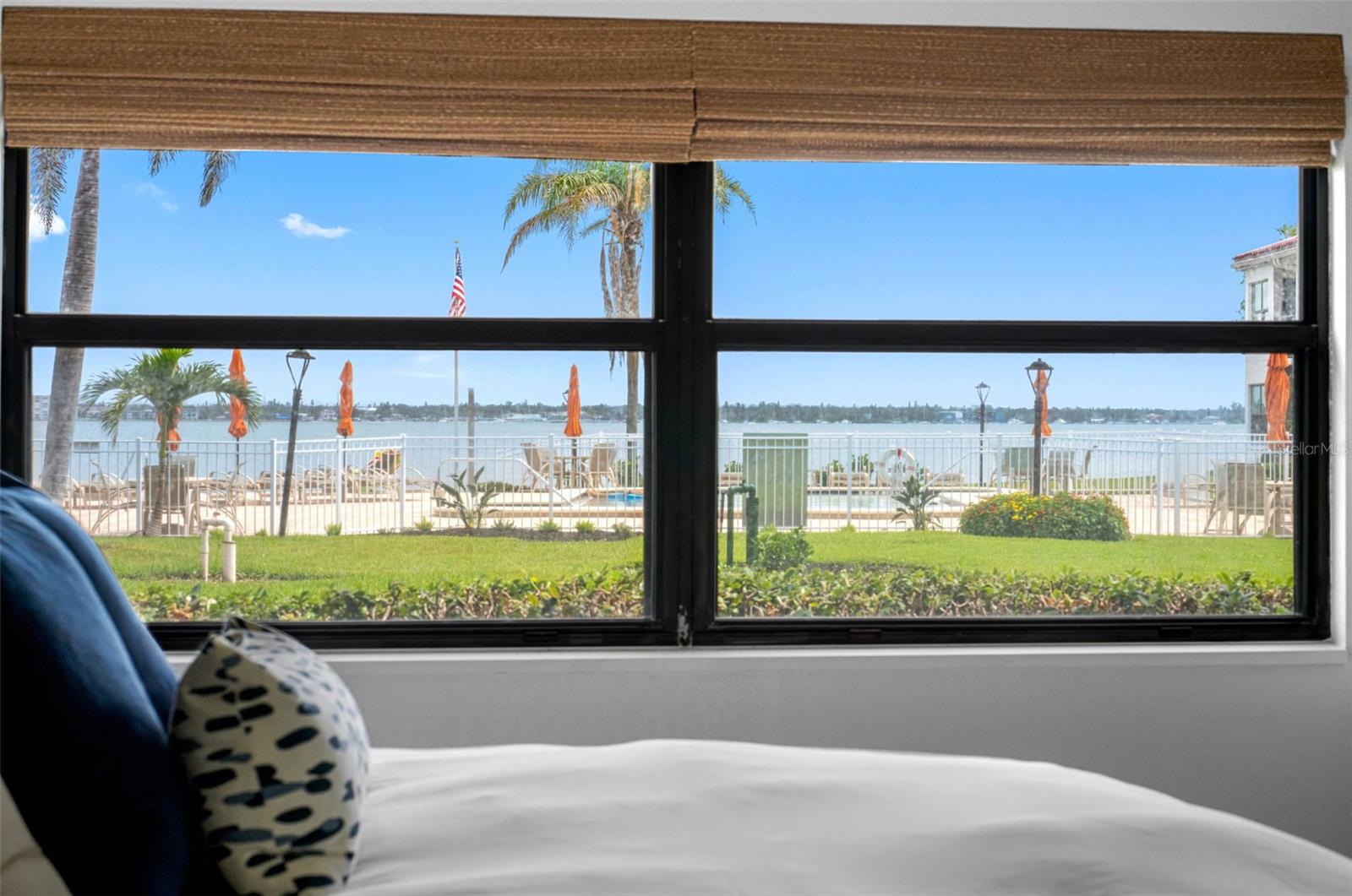 Wake Up to Pool and Bay Views from the Primary Suite