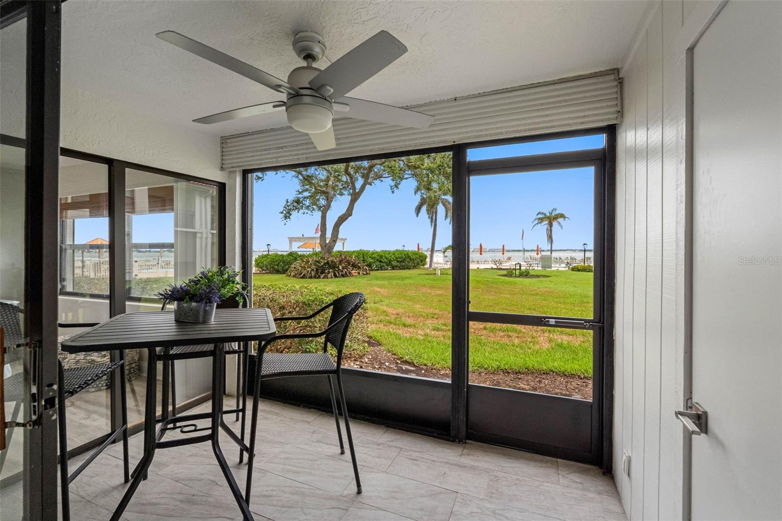 Screened-In Patio with Tiled Floor & Private Storage Closet