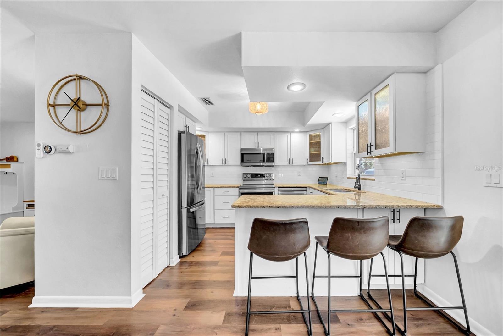 Remodeled Kitchen (2021)- cabinets, stainless steel appliances, backsplash and granite counter tops