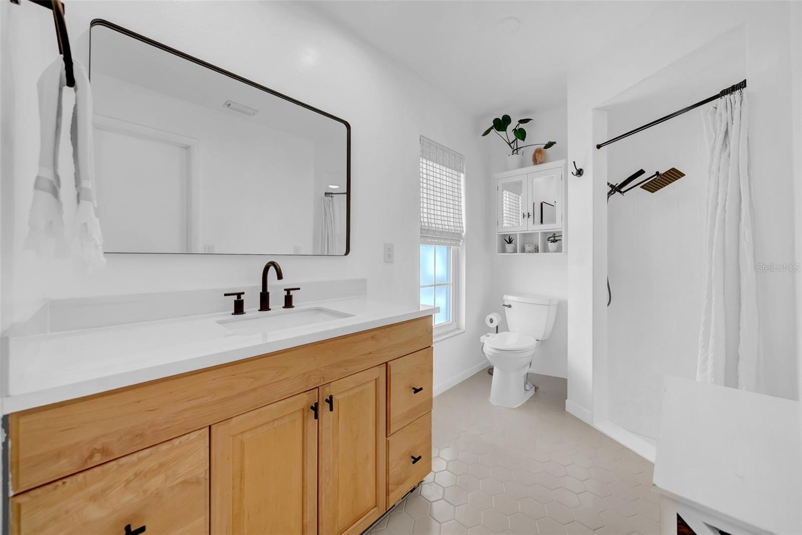 Primary bathroom with walk-in shower.