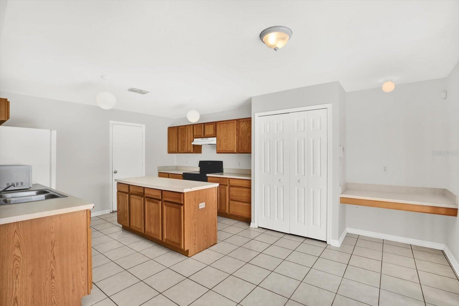 Spacious Kitchen with built in Desk and Island