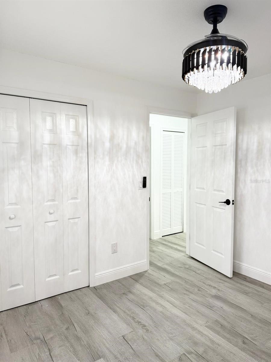 Bedroom 2 with closet view